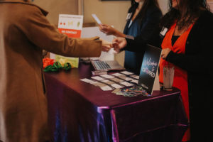 Picture showing check-in table at 2021 Cropped event
